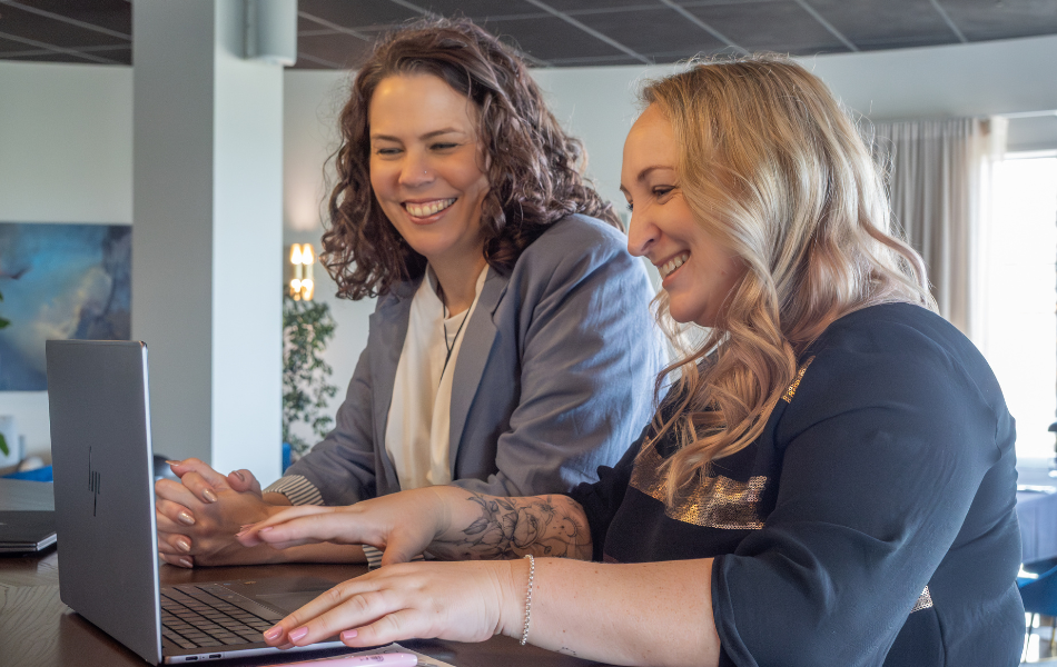 Marianne & Toyah working on a laptop together