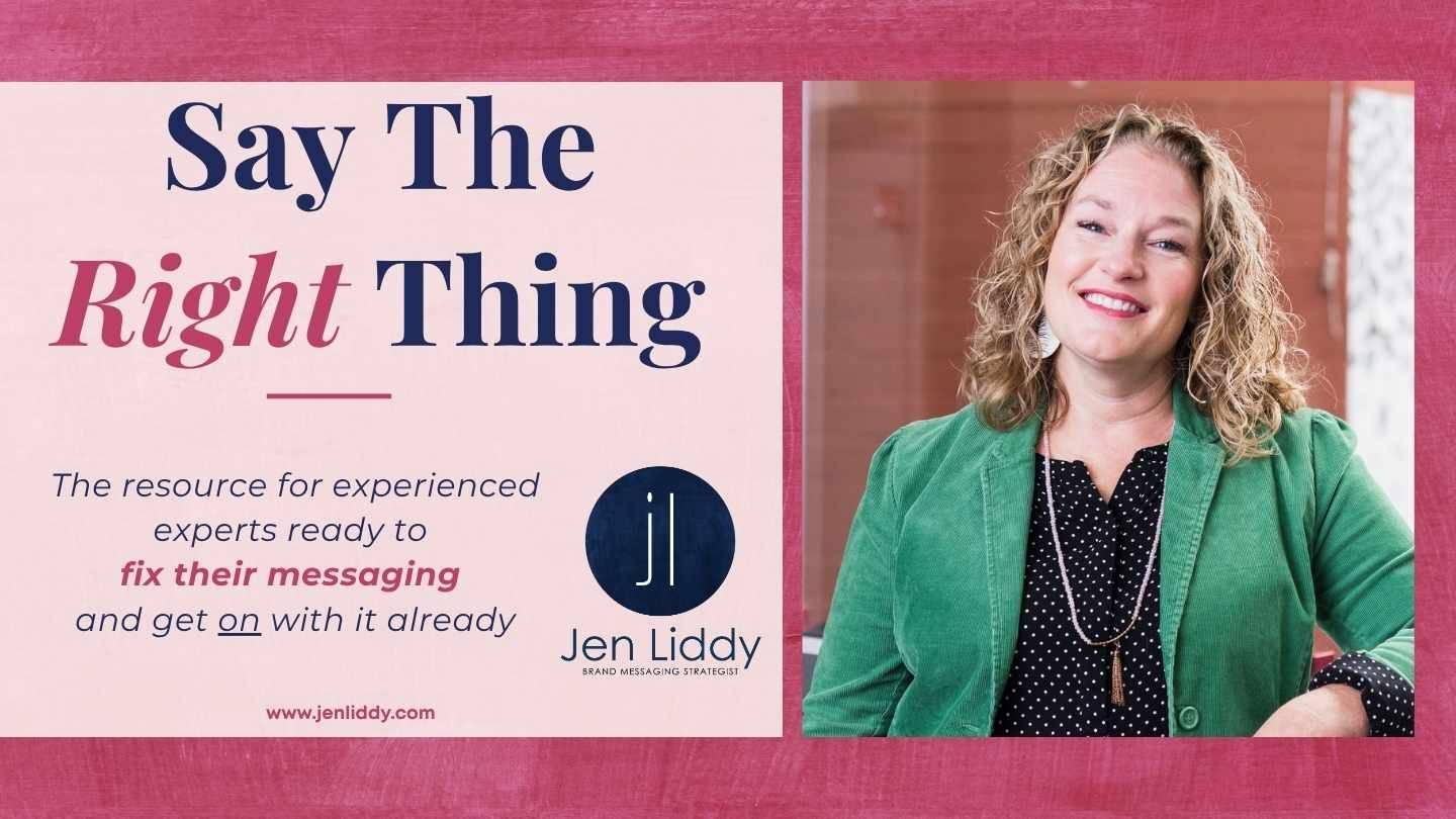 Jen Liddy looking at the camera and smiling, leaning on a ledge, wearing a green jacket.