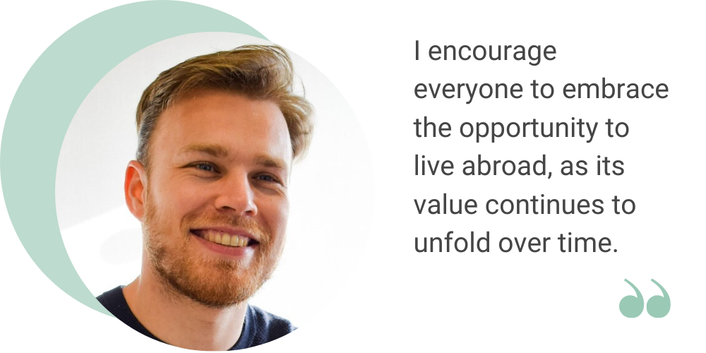 A close up image of Stephan with and white background and the following quote displayed next to him: I encourage everyone to embrace the opportunity to live abroad, as its value continues to unfold over time.