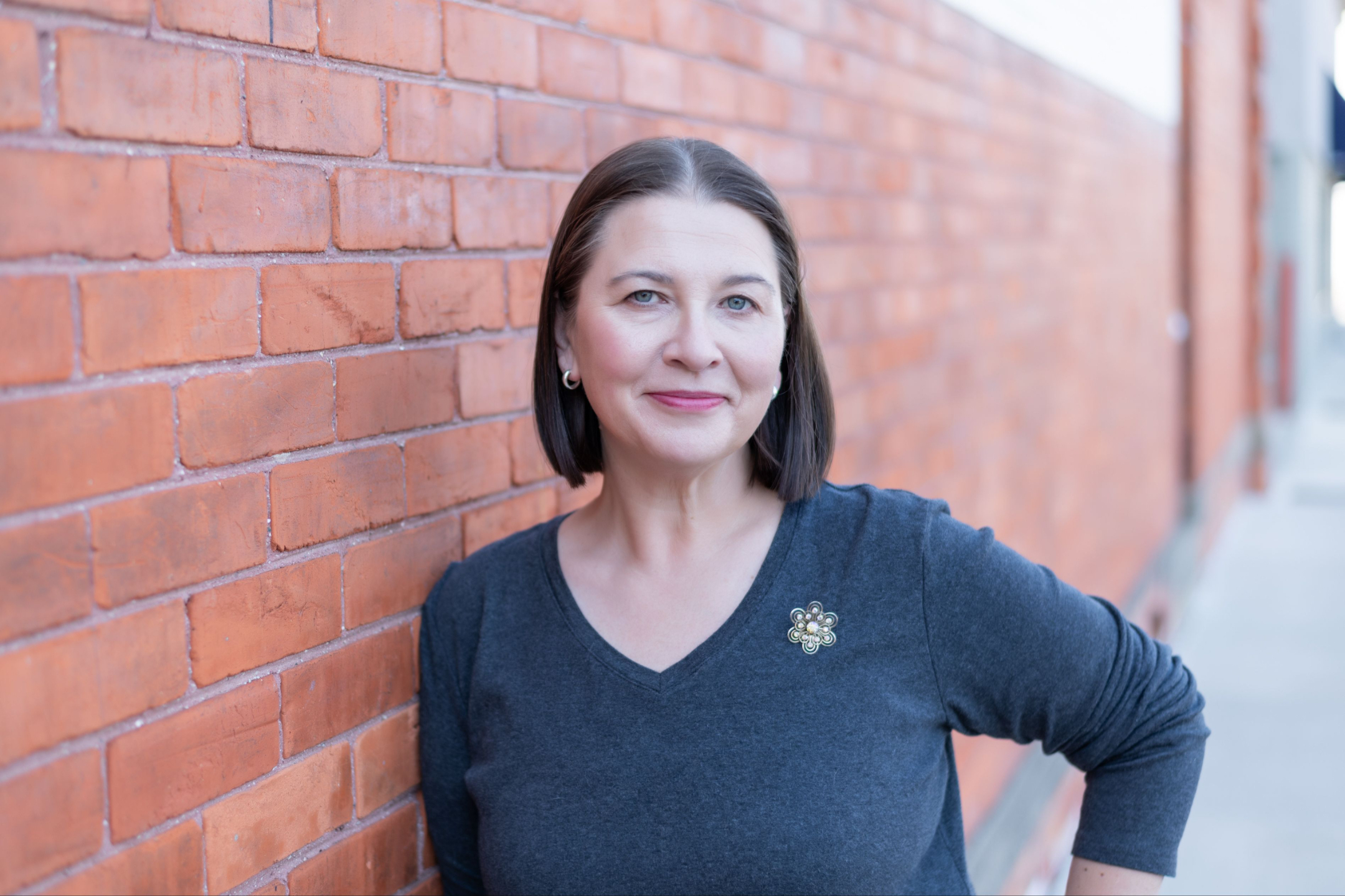 Instructor against a wall of graffiti saying 