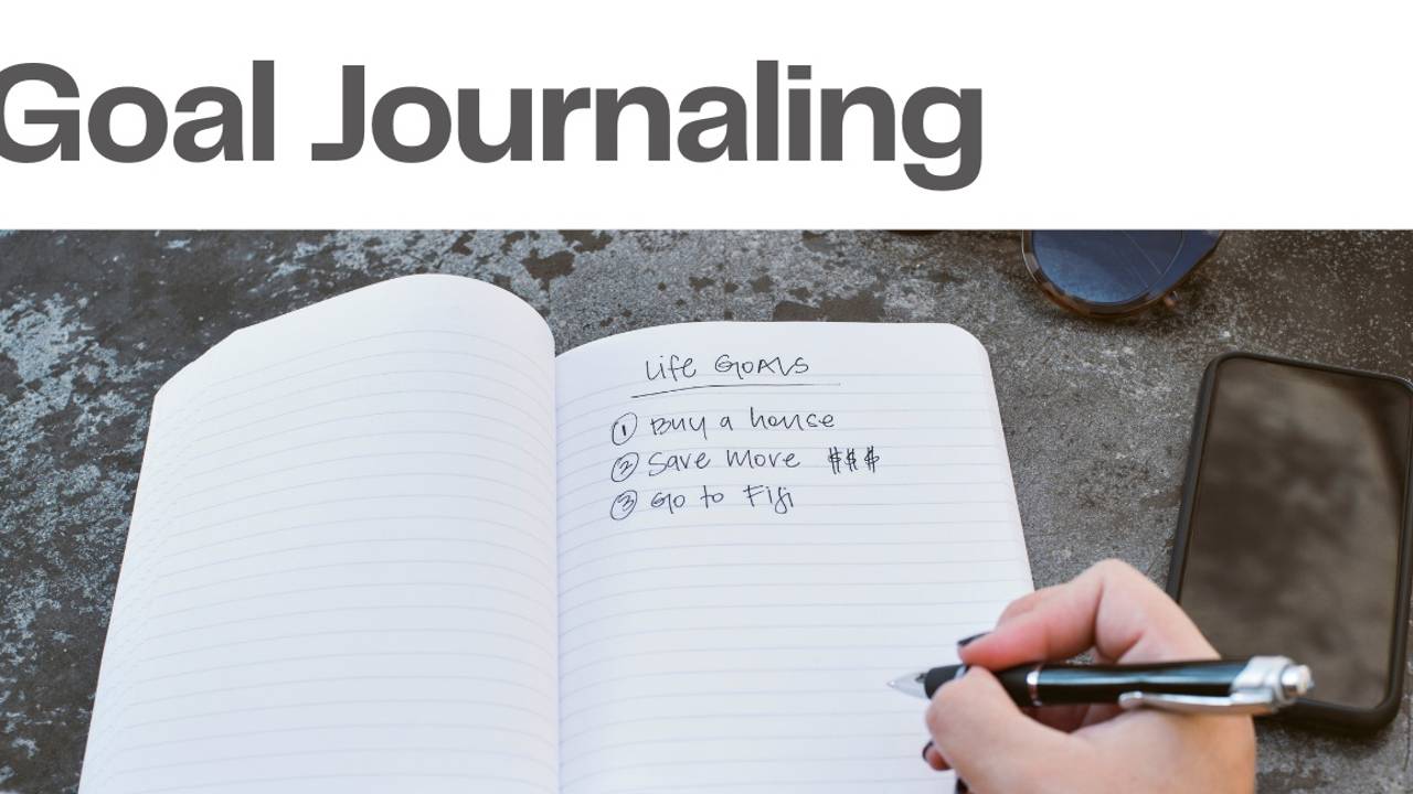 A person journaling about their goals