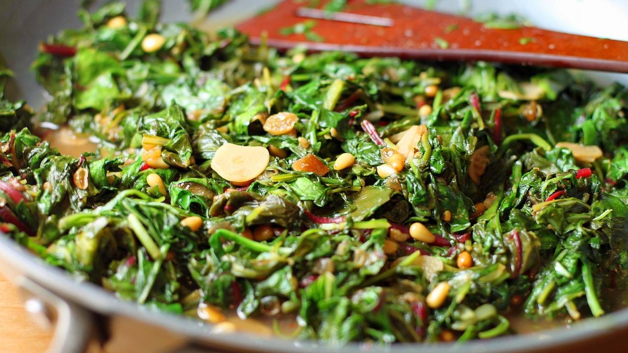 Wilted Greens with Pine Nuts, Garlic & Golden Raisins