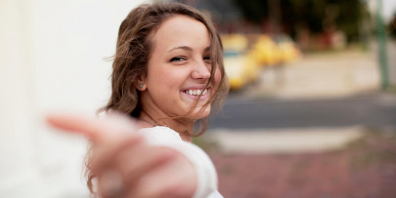 Girl extending hand