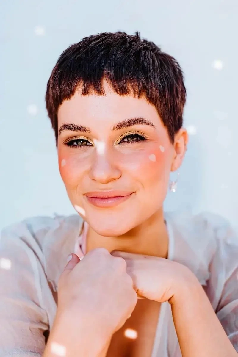 woman with short hair looking at camera closeup