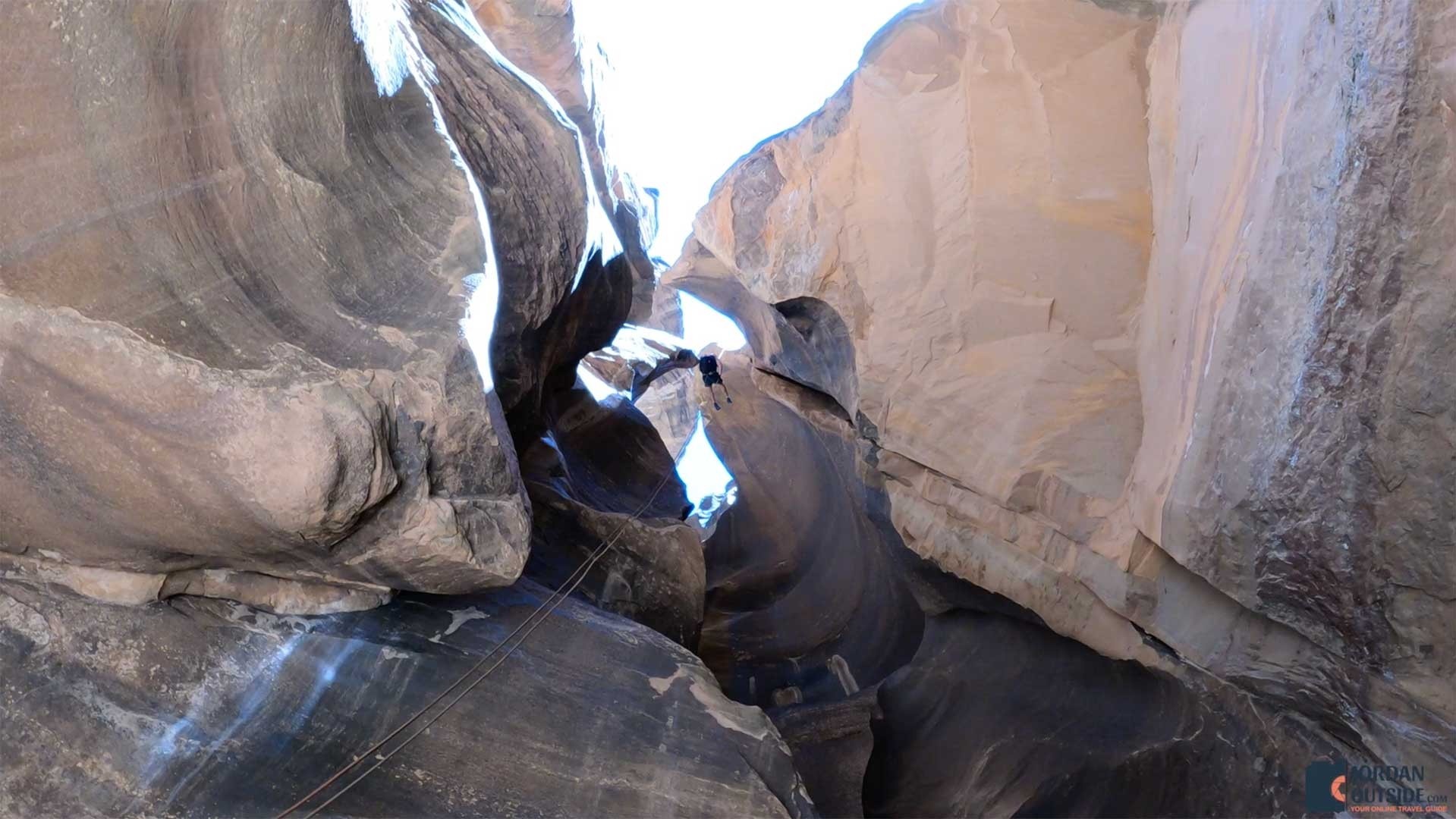 The view looking up of Jordan rappelling down