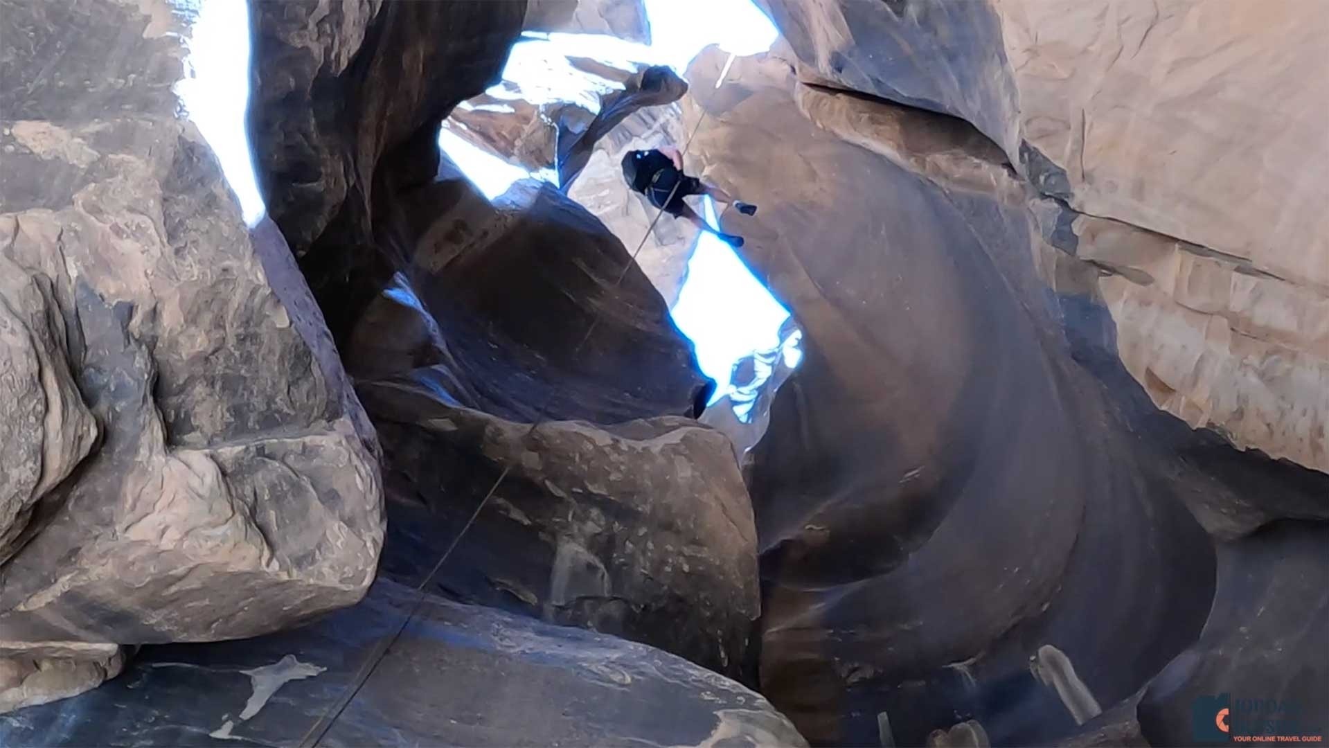 The view looking up of Jordan rappelling down