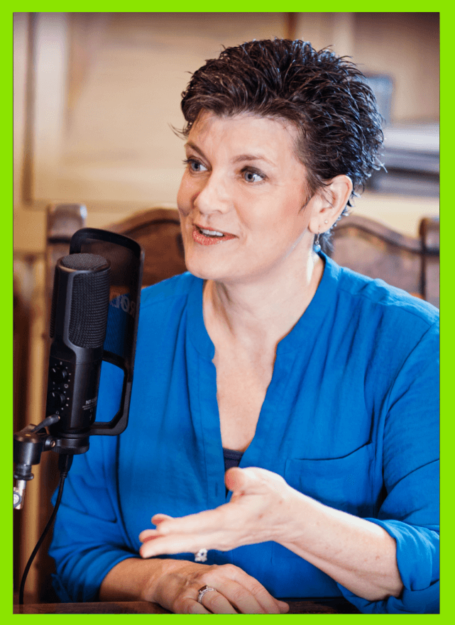 Stacy podcasting with microphone about women leaders