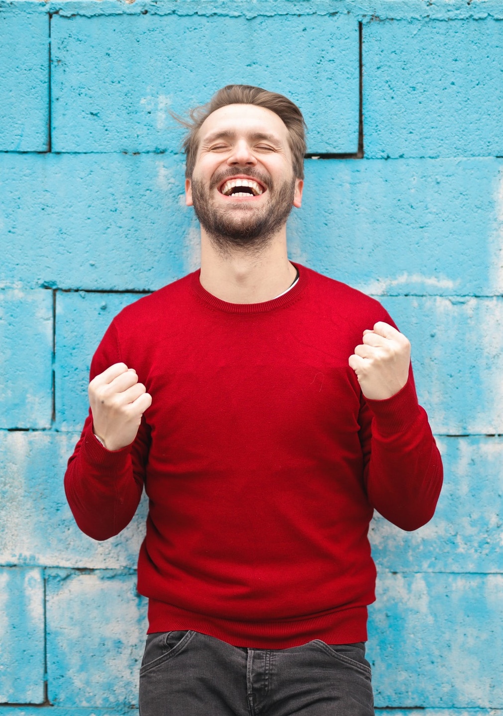 Excited white man with big smile. Photo by bruce mars on Unsplash  