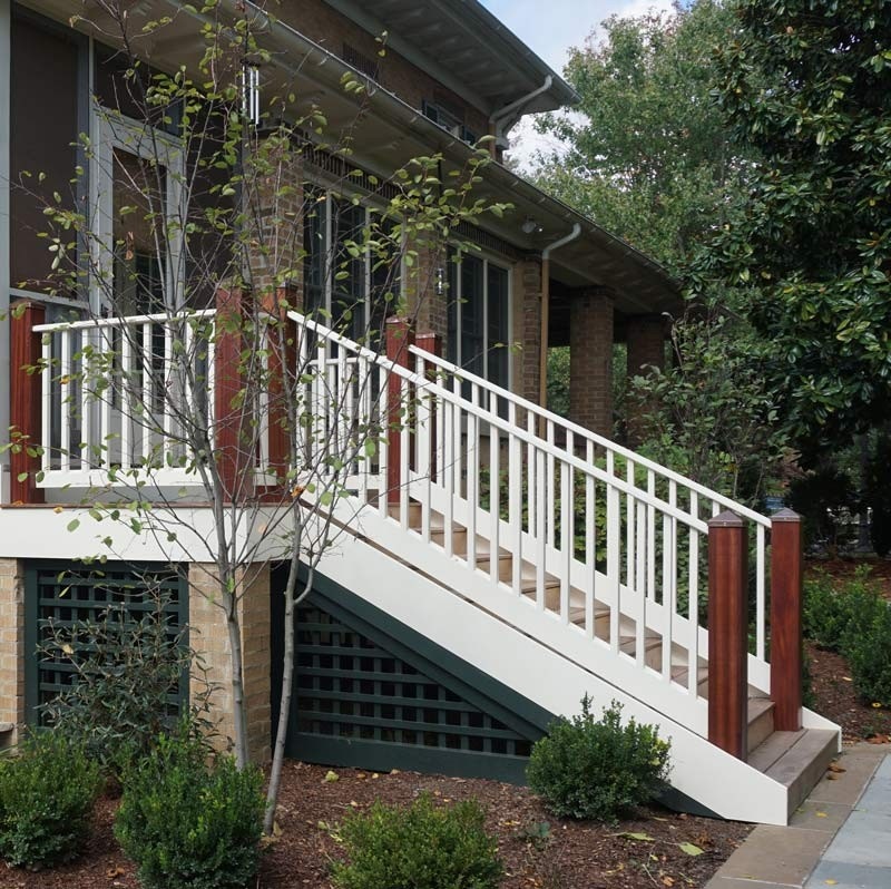 Finished under porch Trelliswork painted a dark forest green encapsulated in molding.