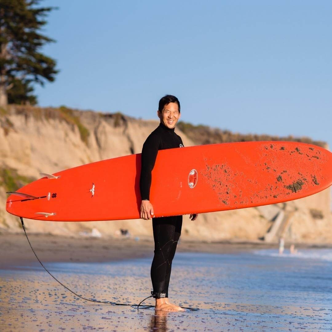 matt hsu with surfboard