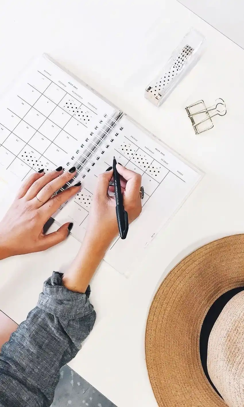 overhead view of writing on a paper planner