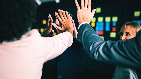 group of people high-fiving