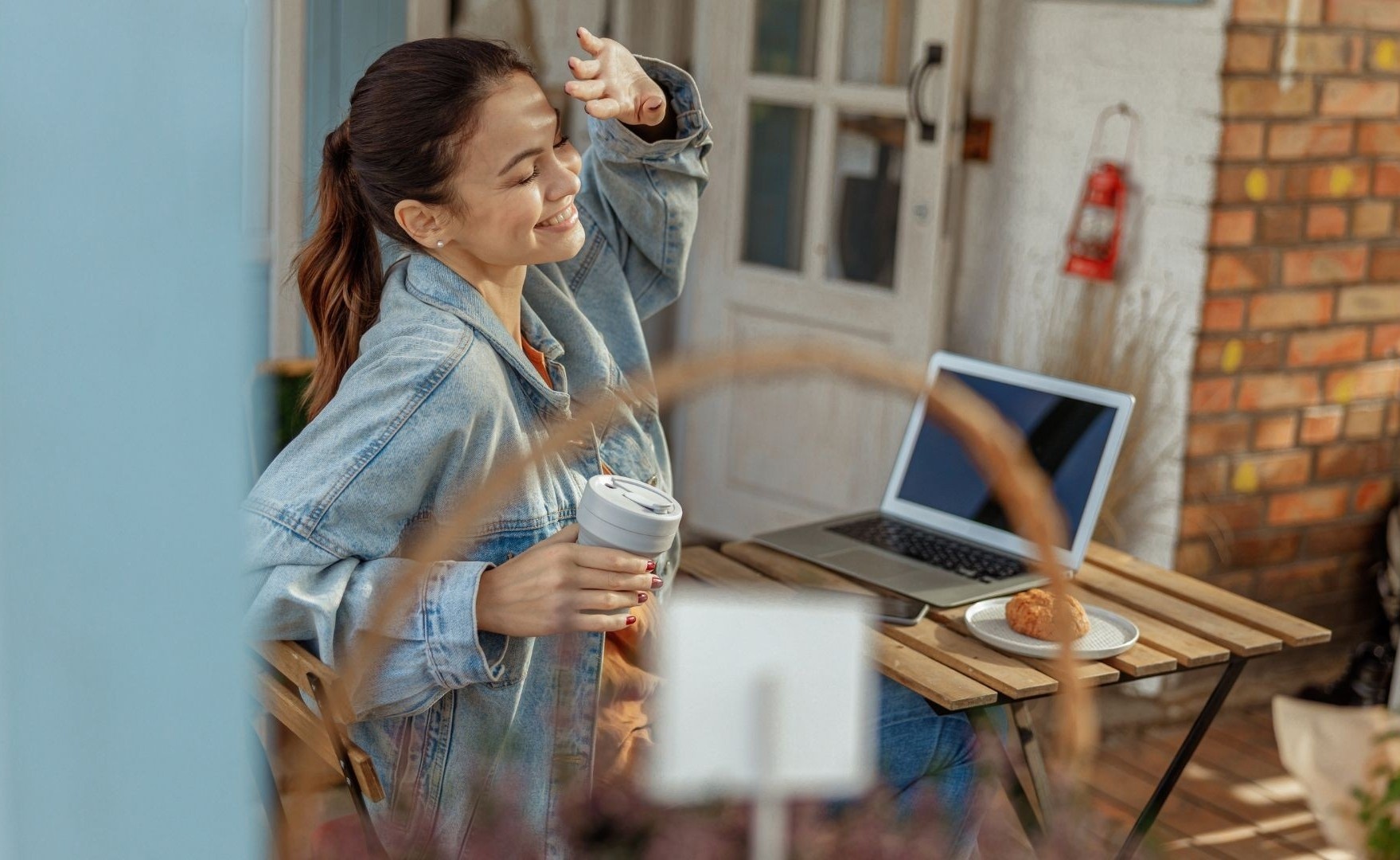Woman enjoying a Kajabi online course in the comfort of home