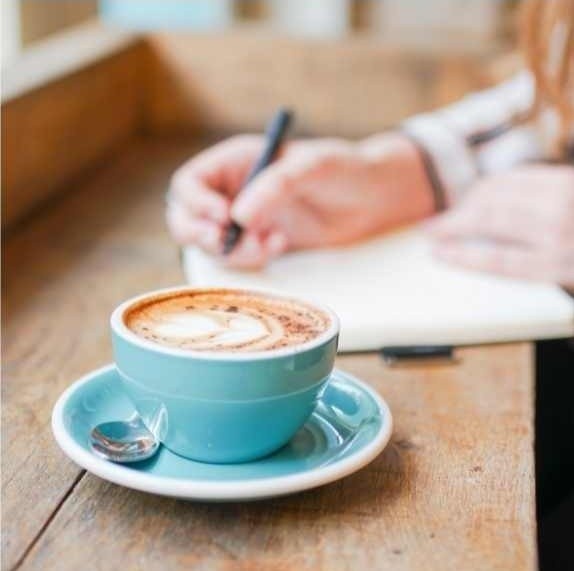 Turquoise mug on a wooden counter top