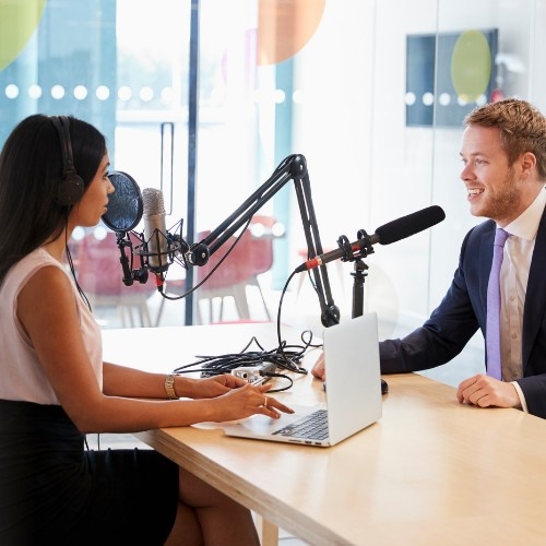 Man and woman doing a podcast