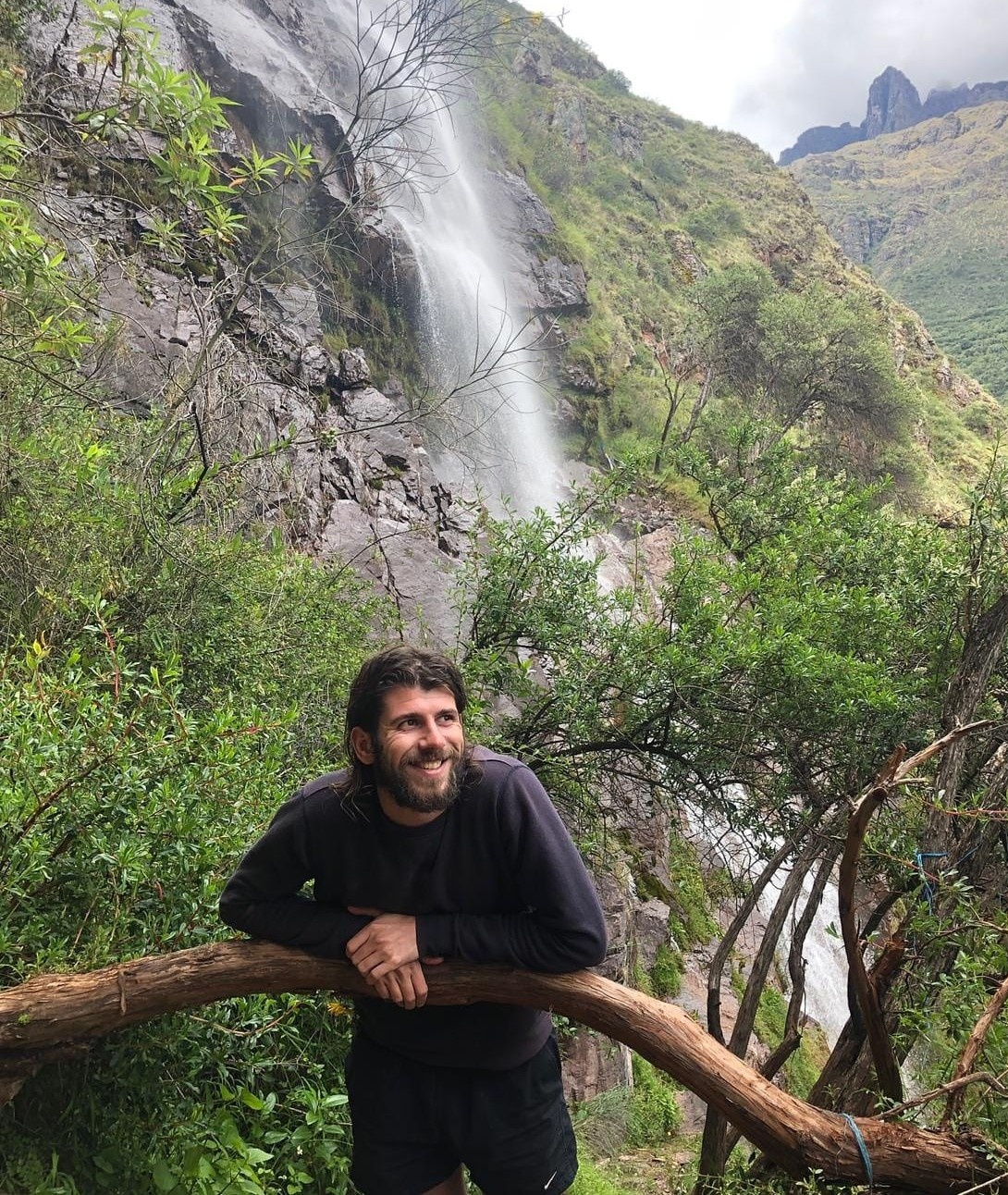 man next to waterfall Peru