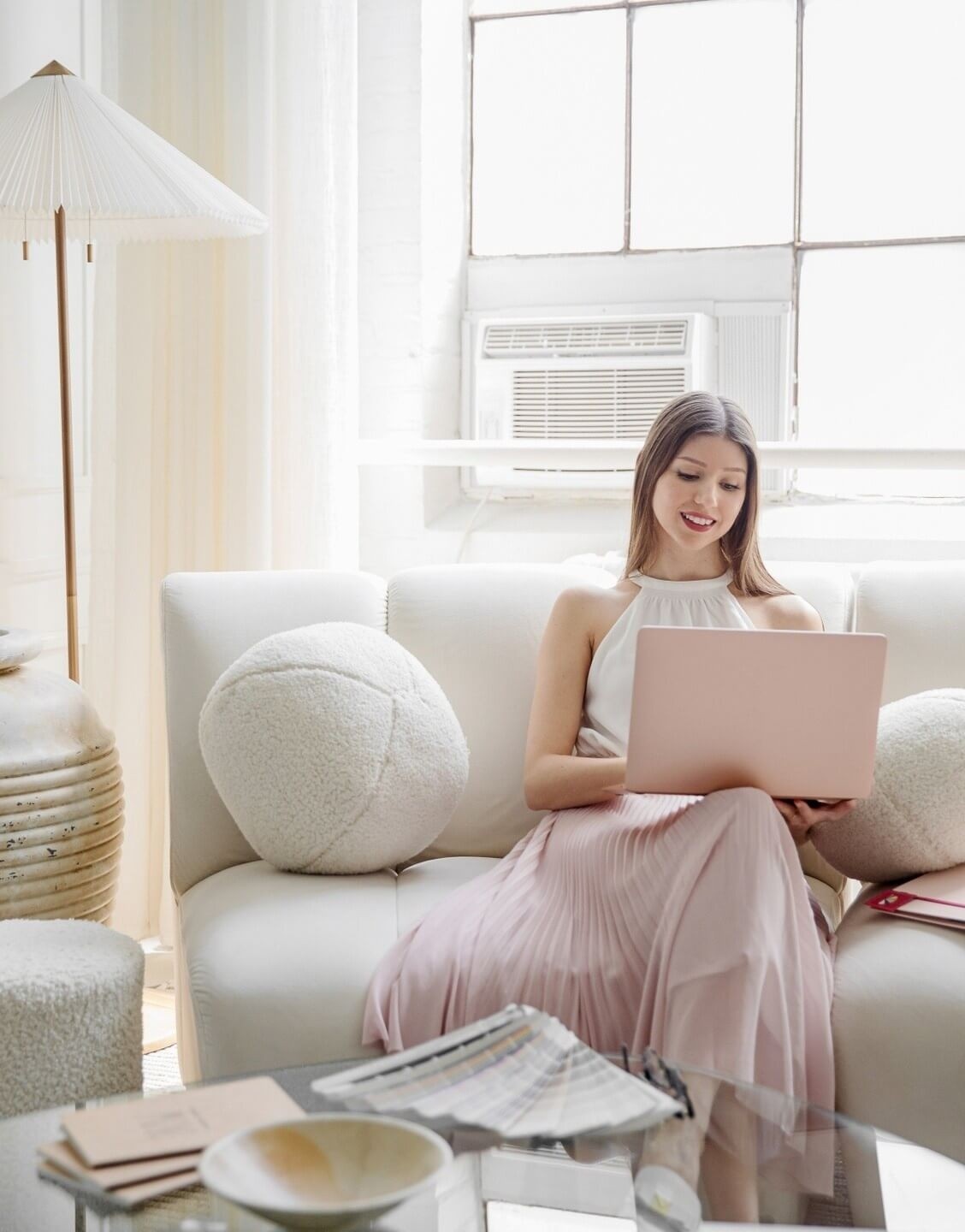 Photo of a home stager styling a tray with a figurine