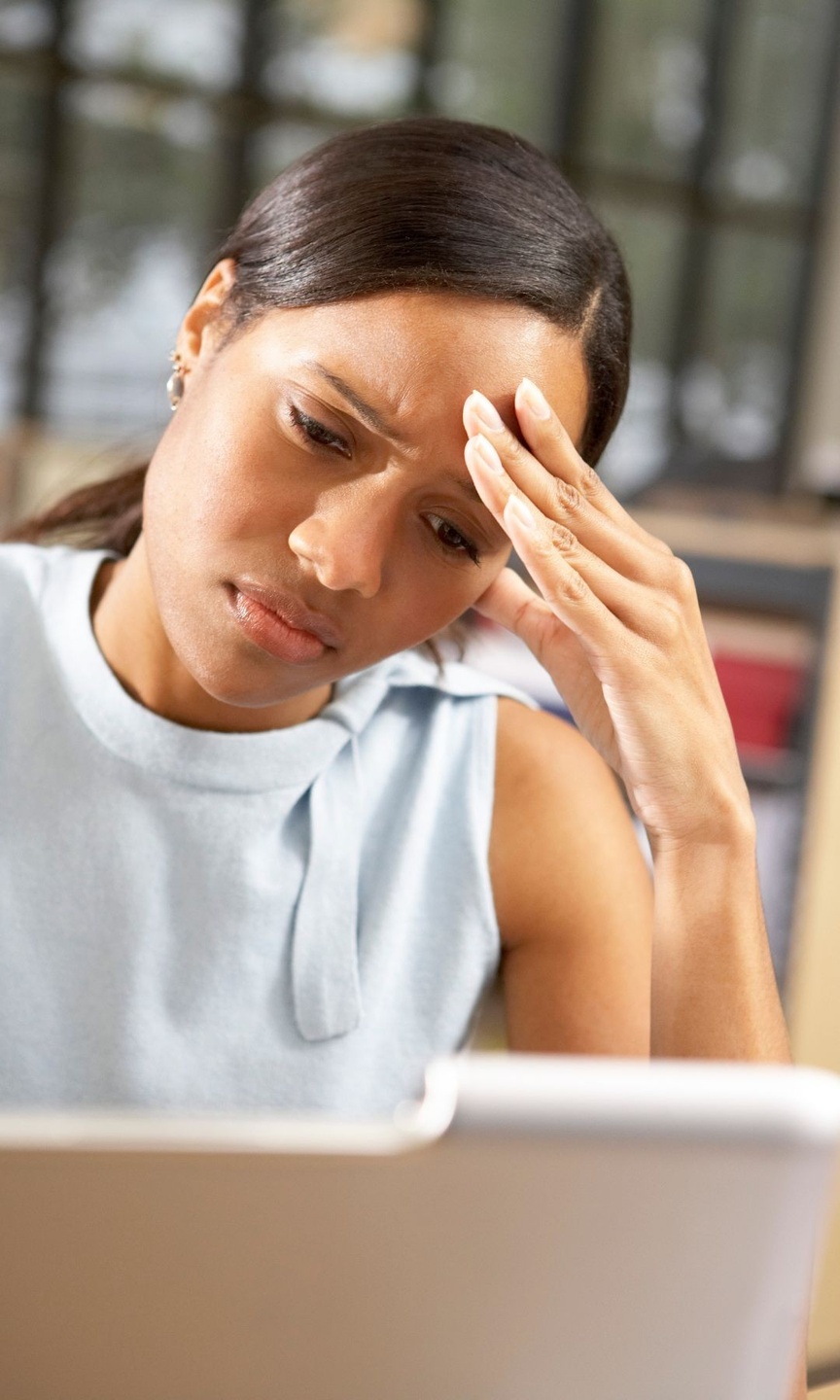 Lady looking at computer frustrated