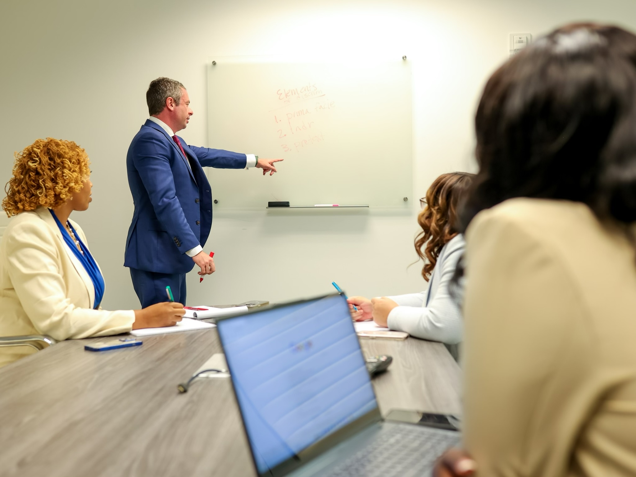 Shaun Southworth leading a federal employment training session with members of the Southworth PC team