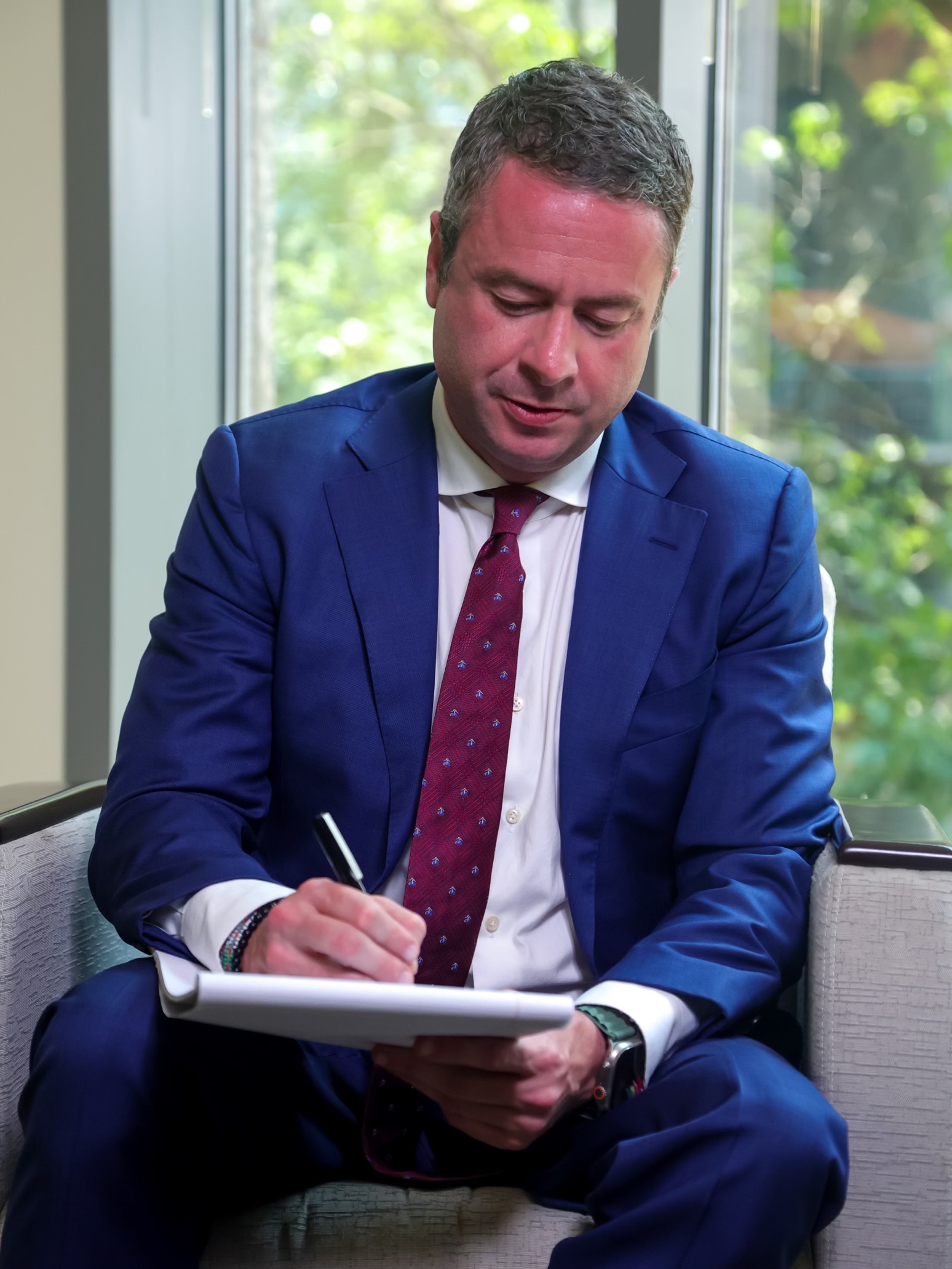 Shaun Southworth writing notes during a professional portrait session