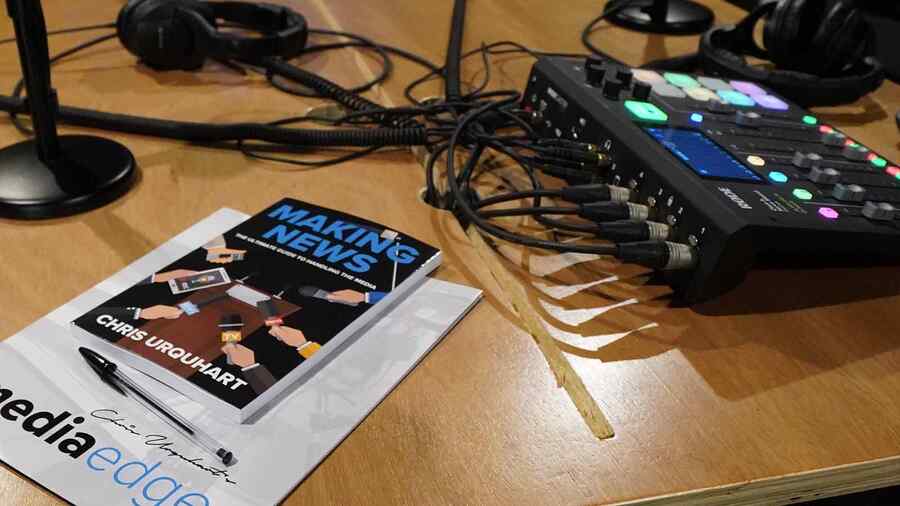 Podcast mixer and Making News book in the studio