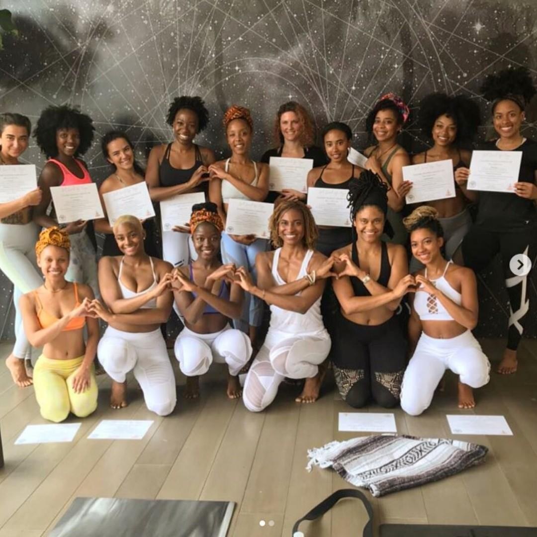 Students holding their certificates after an earlier Koya Webb training