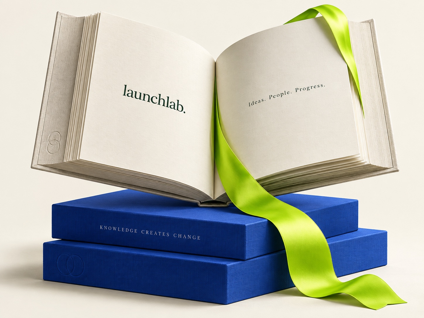 Open Launchlab book with a flowing lime ribbon and cobalt foundations