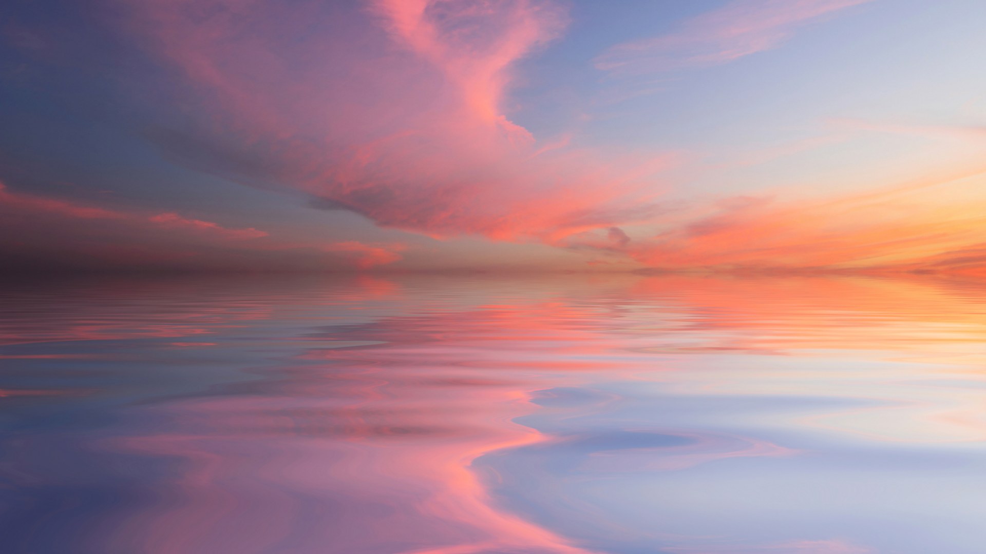 A tranquil ocean beneath a peach and turquoise sunset