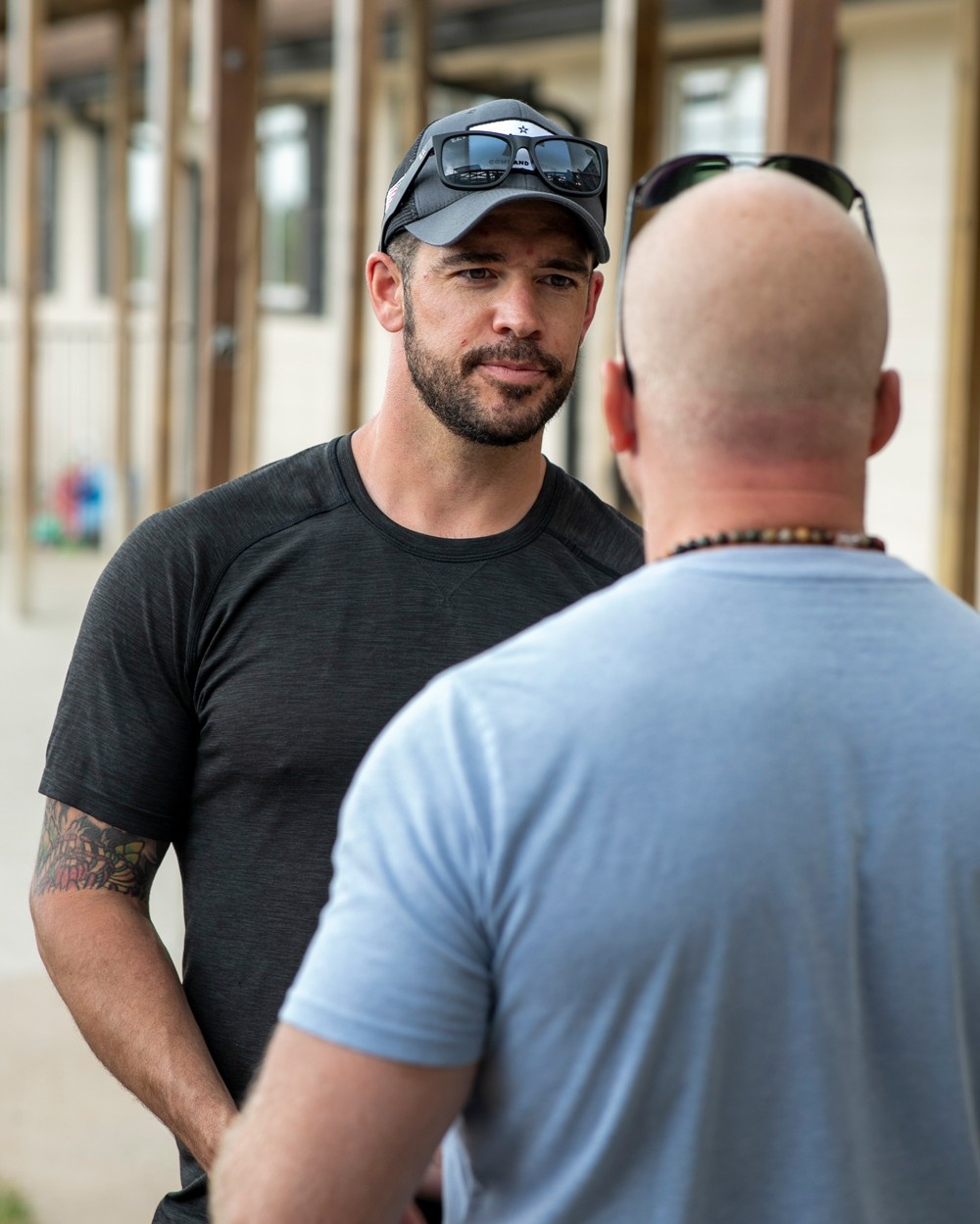 Two men conversing with one another